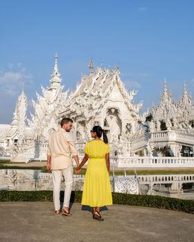 Couple visit the White temple Chiang Rai Thailand, Wat Rong Khun, Chiang Rai, Thailand.