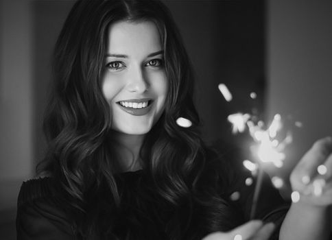 Holiday magic, Christmas and New Year celebration, happy woman with sparklers