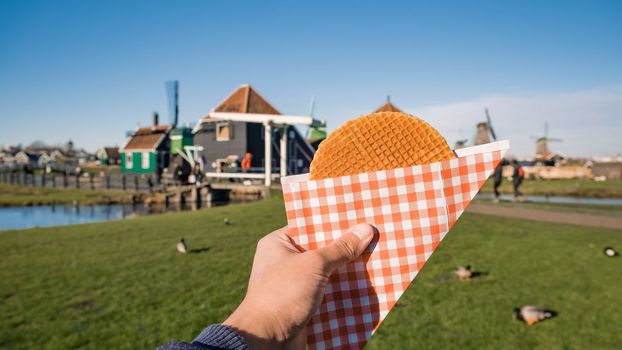 Stroopwafel in Zaanse Schans is a typical Dutch food waffle filled with caramel syrup.