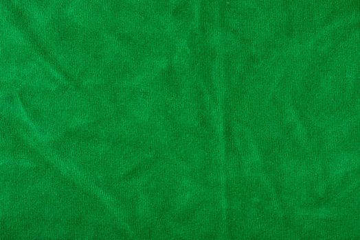 The texture of a microfiber cloth close-up. Napkins for cleaning and cleaning green surfaces. Washable.