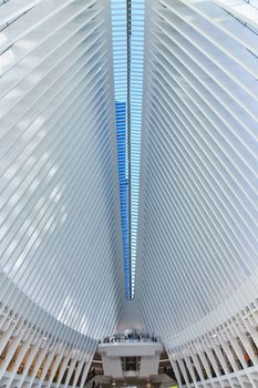 Spine of skylight with white ribs in huge interior architecture of subway in New York City