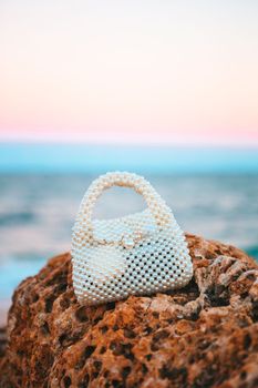 Pearl bag on the beach a sunset