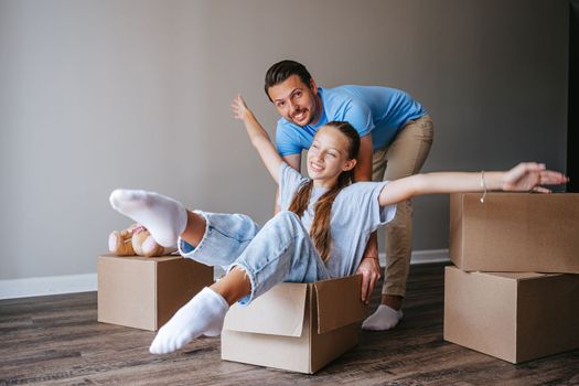 Family have fun on moving day in their new home