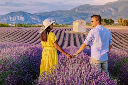 Couple men and woman on vacation at the Provence Lavender fields, Provence, Lavender field France