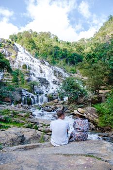 Couple visit Mae Ya Waterfall Doi Inthanon national park Thailand Chiang Mai