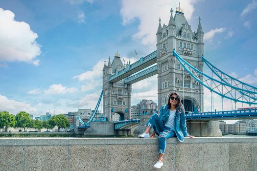 Asian women on city trip in London by the river Thames at the famous places in London,Tower Bridge