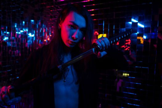 Male transgender neon light studio. Asian with samurai sword.
