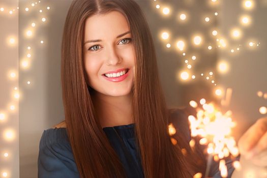 Holiday magic, Christmas and New Year celebration, happy woman with sparklers