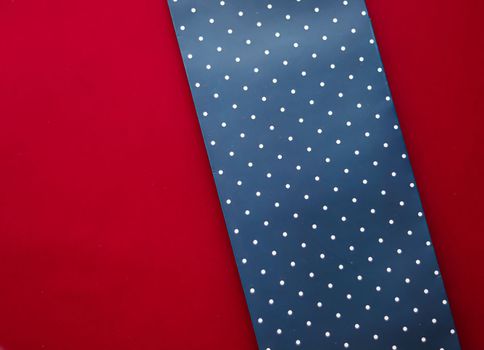 Abstract blue polka dot background on red backdrop