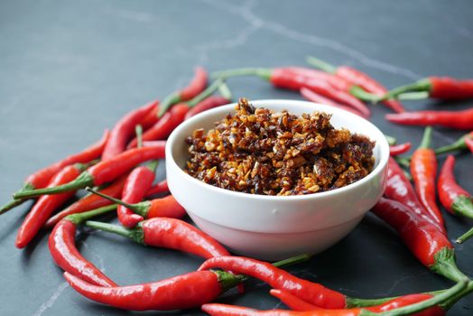 chili and garlic flakes in a container 