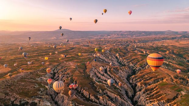Cappadocia Turkey sunrise in the hills with hot air balloons, Kapadokya Turkey Goreme