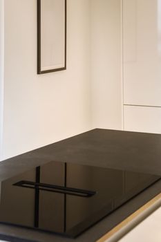 a black table in a white room with a picture