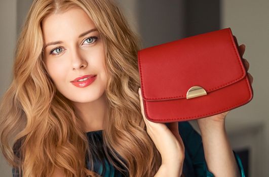 Fashion and accessories, happy beautiful woman holding small red handbag with golden details as stylish accessory and luxury shopping