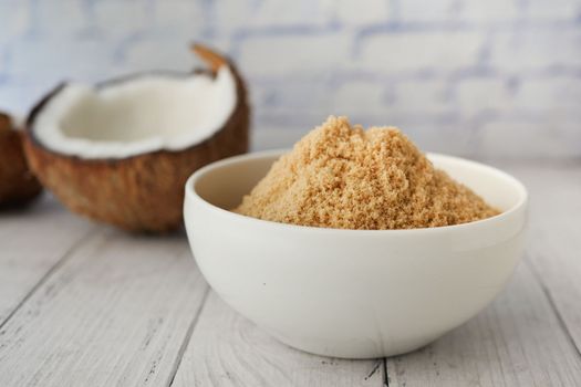 coconut sugar in a white bowl on table 