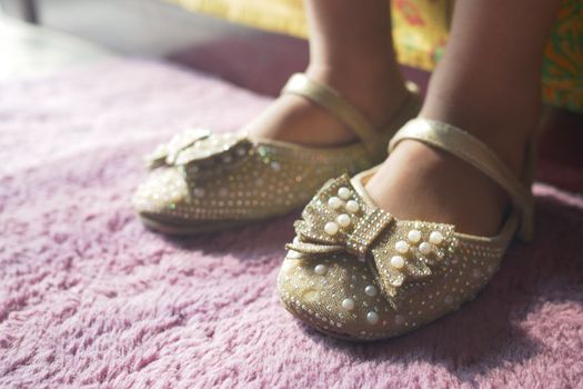 child girl feet wearing sandal at early morning 