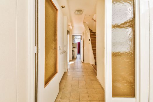 the hallway of a house with a hallway door open