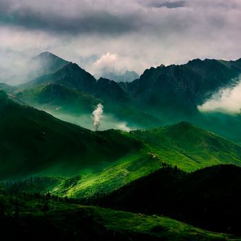 Green mountain range. Landscape of misty mountains