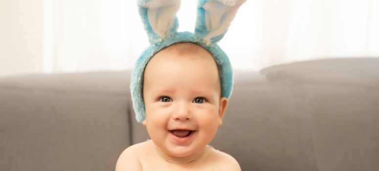 Boy dressed as bunny and Easter eggs