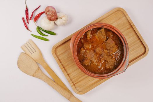traditional Indian curry lamb masala in a bowl on table 