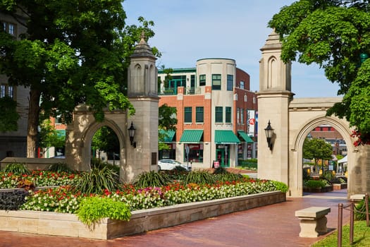 Sample Gates entrance to Indiana University with summer flowers