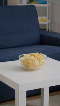 Modern empty apartament with nobody in it is ready for night party having chips bowl