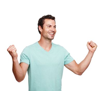 Happy, cheerful and man in celebration for winning, discount or goal against a white studio background. Isolated male model winner with smile celebrating win, sale or achievement on mockup.