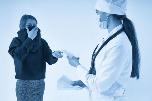 Doctor giving a patient protective face mask to protect from virus infection, coronavirus concept