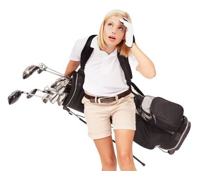 Oh no, looks like it might rain soon. Studio shot of a exhausted female golfer carrying her bag isolated on white.