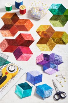 Preparing of bright diamond pieces of fabrics for sewing quilt, sewing and quilting accessories