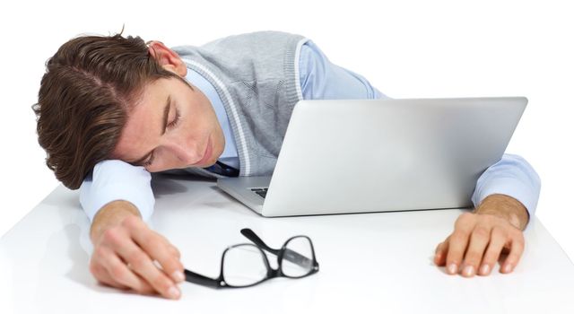 Tired businessman sleeping with laptop, white background and burnout. Fatigue, lazy and sad worker taking a nap at computer, studio background and frustrated from anxiety, mistake and sick stress