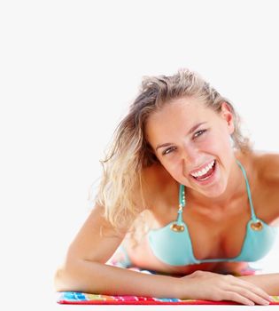 Smiling young bikini woman enjoying a sunbath against white. Pretty young female in bikini enjoying a sunbath against white background.