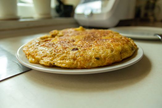 Traditional Spanish tortilla on a plate, prepared at home
