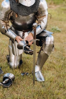 Close-up of a medieval knight in armor preparing for battle