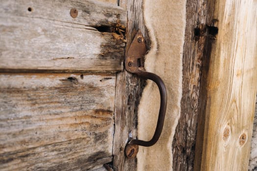 wooden barn door with handle. old wooden buildin
