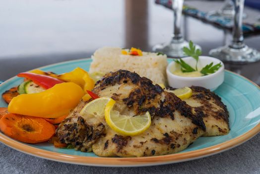 Grilled fish steak a la carte meal with vegetables