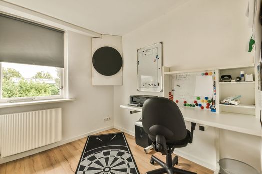 Spacious room with working desk and armchair