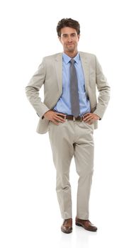 Taking a relaxed approach to business. Studio portrait of a handsome young businessman isolated on white.