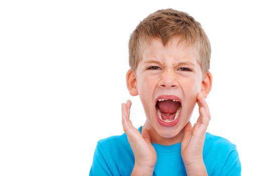Frustrated kid, studio portrait and shouting with anger facial expression by white background for mental health. Boy child, crying and isolated with frustrated emotion, adhd and autism in childhood