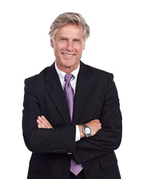 Confidence is the key to success. Cropped portrait of a businessman standing with his arms folded against a white background.