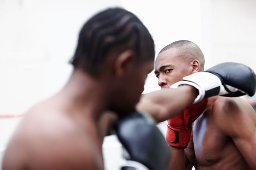 Boxers fighting. Two African American male athletics boxing in ring.