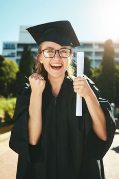 Graduation, education and success with a woman student or graduate in celebration of an academic achievement. Portrait, winner and wow with a female pupil cheering her diploma or certificate