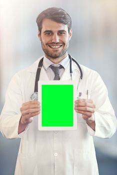 Medical advice at your fingertips. Portrait of a doctor presenting a digital tablet.