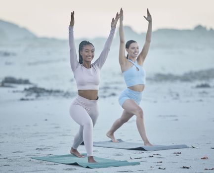 Yoga, fitness and beach with woman friends together on the sand for exercise, mental health and wellness. Nature, diversity and training with a female yogi and friend exercising while bonding outside