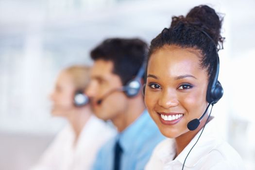 Perfect customer support. Closeup of helpful African American female professional on call with colleagues.