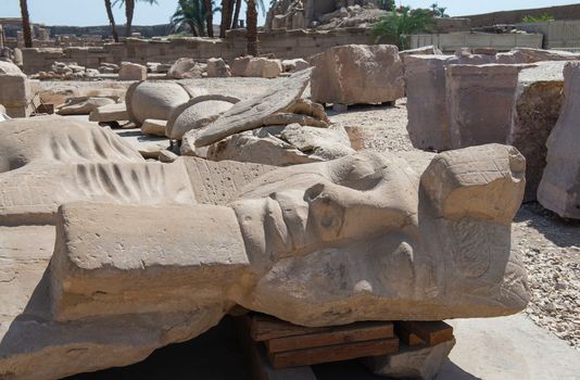 Large broken statue of Ramses 2nd at Karnak temple in Egypt