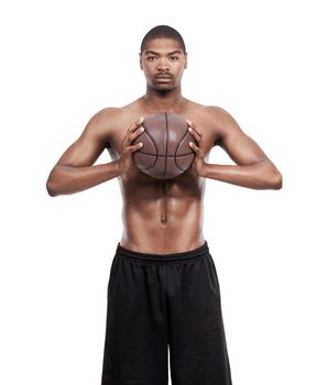 Throwing you a pass. Portrait of a handsome young basketball player standing shirtless in the studio.