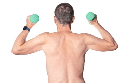 Rear view of senior man exercising with dumbell