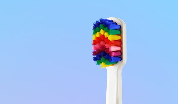 White toothbrush with multicolored bristles. Bristles in all colors of the rainbow. Rainbow toothbrush with white knob. Fashionable oral care.