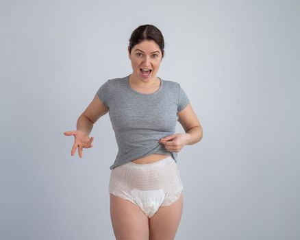 A woman in adult diapers. Urinary incontinence problem.