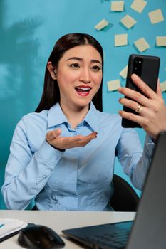 Corporate female employee having online meeting